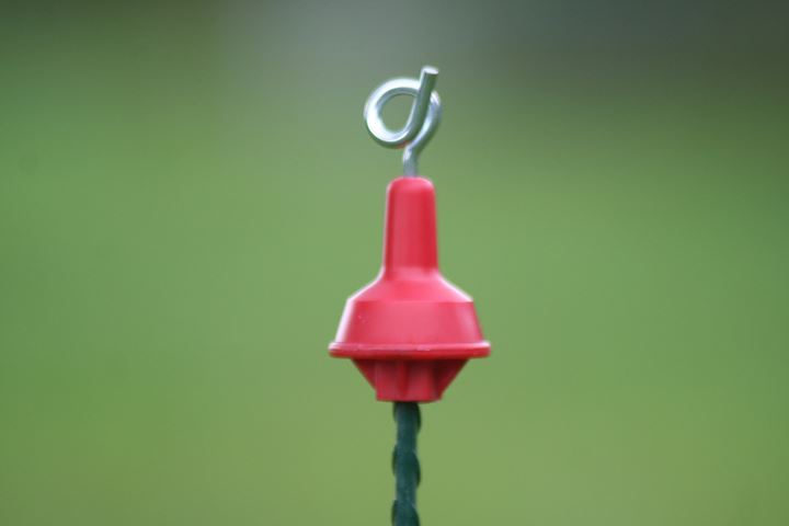Losse krulstaart-topisolator kleur rood, ter vervanging. Geschikt voor de ovale veerstalen paal.